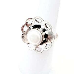 925 marked 3/4 inch, Pearl ring with petals coming up. Ring size 7.5.